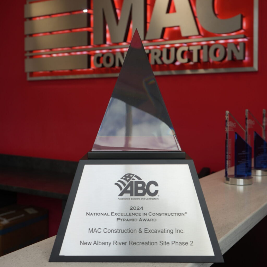 Pyramid-shaped award trophy with ABC logo on a countertop, recognizing MAC Construction & Excavating Inc. for 2024 National Excellence in Construction Pyramid Award (New Albany site).