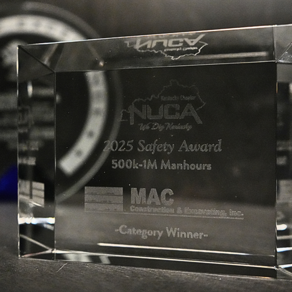Crystal award trophy engraved with '2025 Safety Award' and '500k-1M Manhours' (Category Winner).